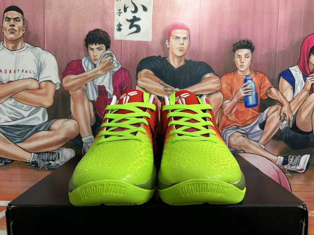 Front view of red and bright green Nike Kobe basketball shoes with neon green laces.