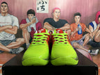 Front view of red and bright green Nike Kobe basketball shoes with neon green laces.