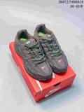 Pair of dark gray Nike P-6000 sneakers with neon green lace accents displayed on a red Nike shoe box.