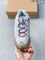 Top view of the sneaker showing the mesh toe box, textured overlays and burgundy-and-blue lace system.