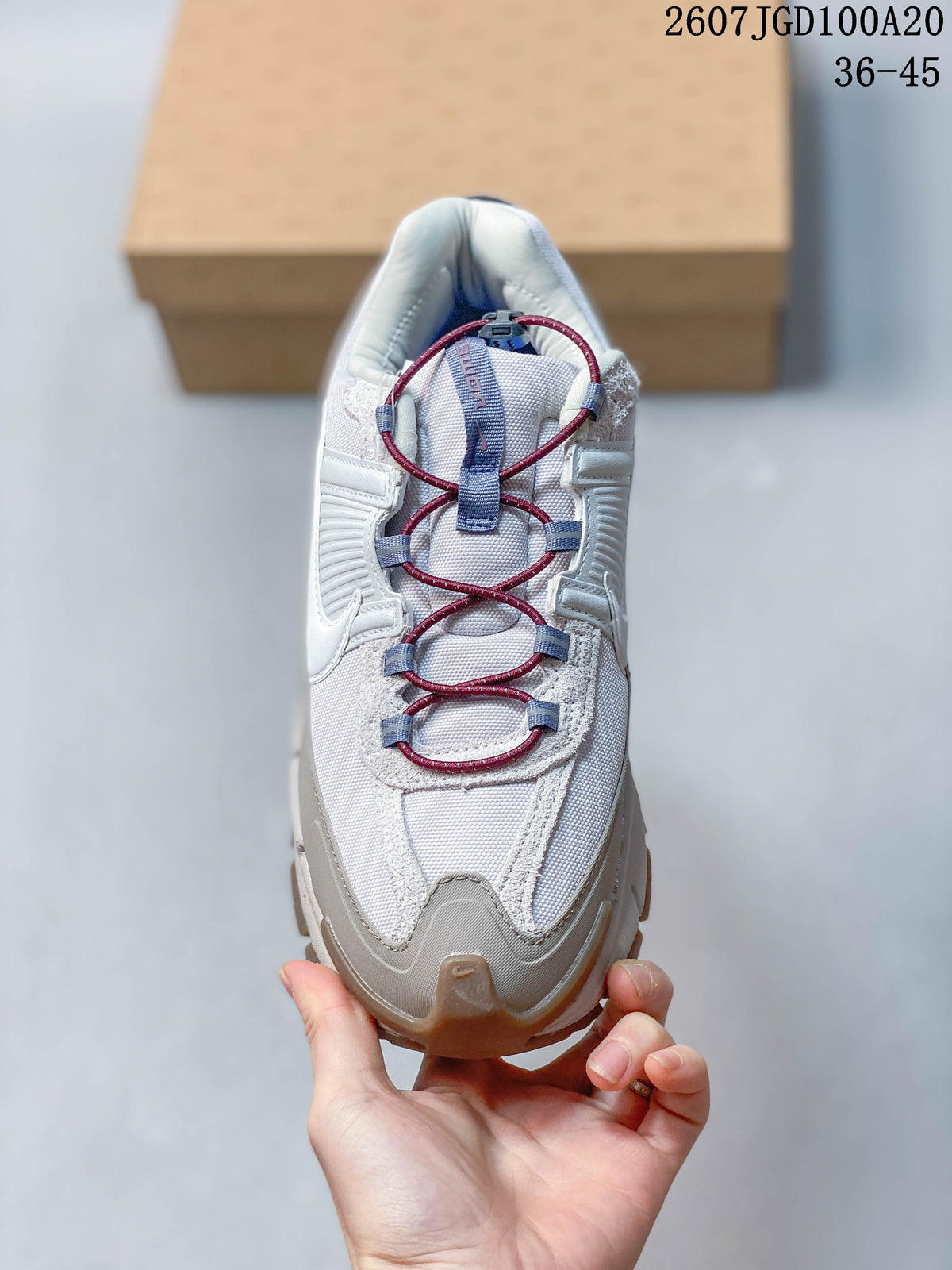 Top view of the sneaker showing the mesh toe box, textured overlays and burgundy-and-blue lace system.