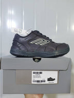Side view of the grey sneaker resting on its box; the box label shows Hampton Sneaker, model 1190, Grey and size C 39.