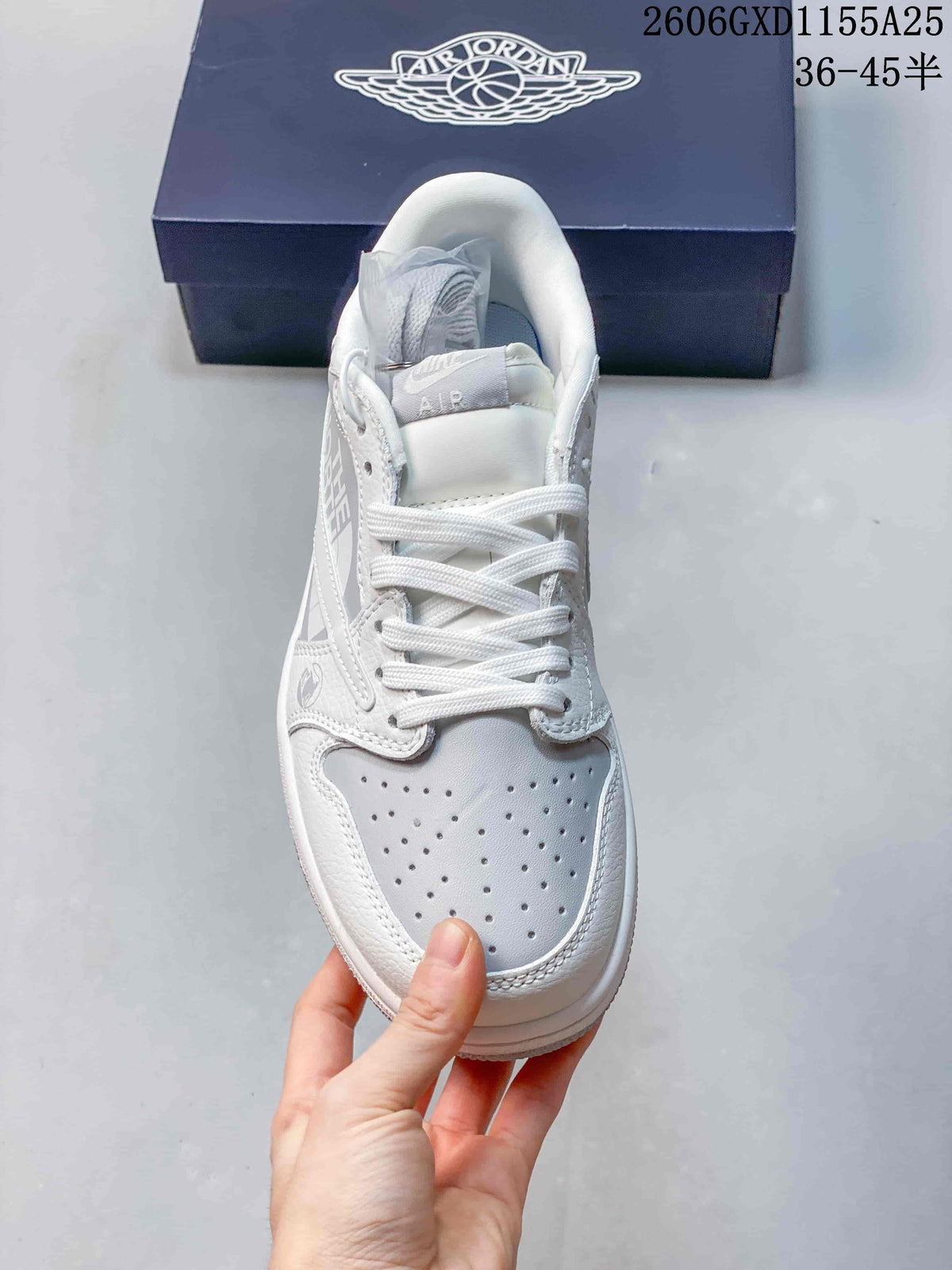 Top view showing the sneaker’s perforated toe, white laces, and light grey panels.