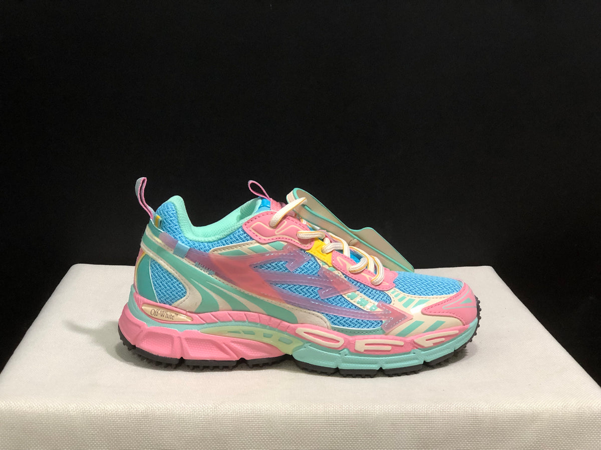 Single side profile of the sneaker showing the blue mesh upper, pink overlays, mint accents and black outsole.
