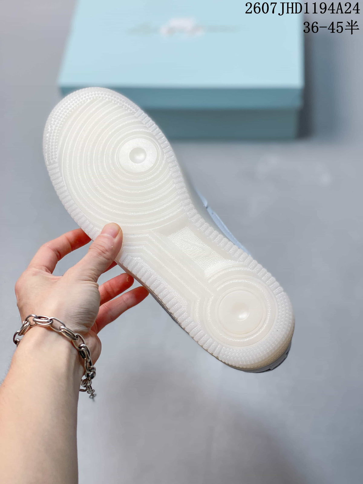 Close-up of the white outsole showing concentric traction patterns and a translucent finish.