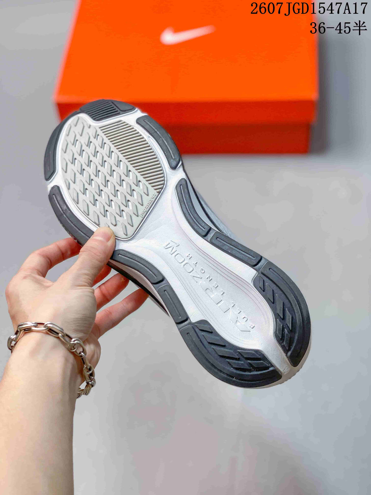 Bottom view of a Nike Pegasus 42 shoe showing the segmented gray and black outsole pattern and textured central section.