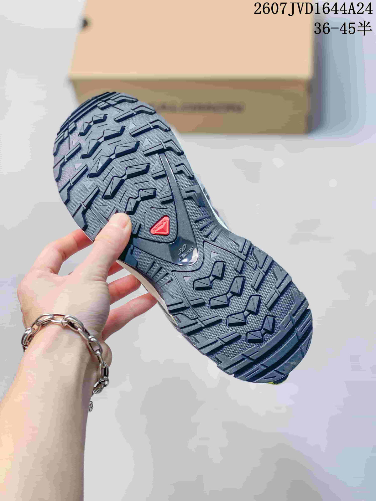 Close view of the Salomon sneaker outsole showing a black lugged tread pattern and XA PRO 3D marking.