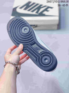 Close-up of the dark textured rubber outsole with circular pivot details.