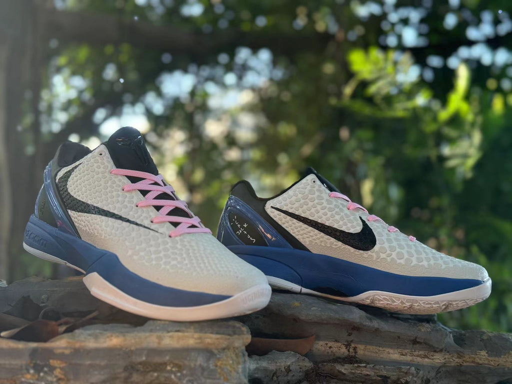 Pair of Kobe 6 shoes displayed together, showing pink laces and contrasting blue midsoles.