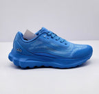 Side view of a blue Alo Runner sneaker showing the layered upper, laces and chunky outsole.