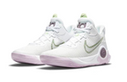 White basketball shoes with pale pink outsole accents and muted green Swoosh detailing.