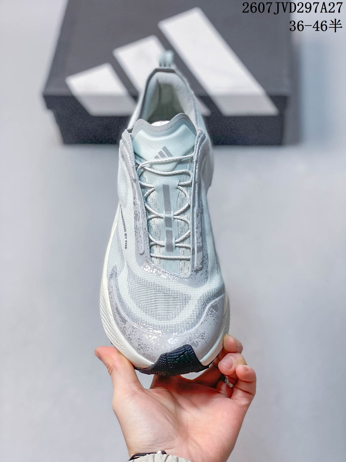 Top view showing the lace-up construction, padded opening, adidas logo, and textured toe area.