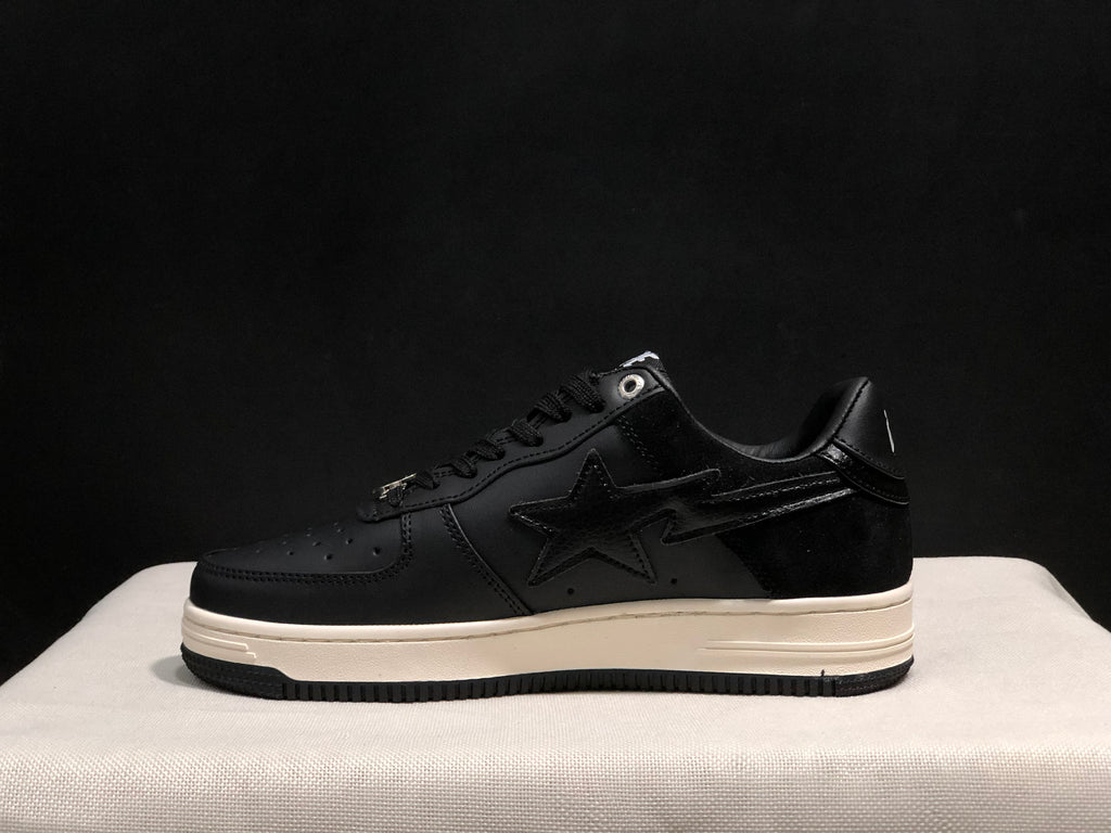 Side profile highlighting the black upper, star detail, white midsole, and black outsole.