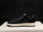 Side profile highlighting the black upper, star detail, white midsole, and black outsole.