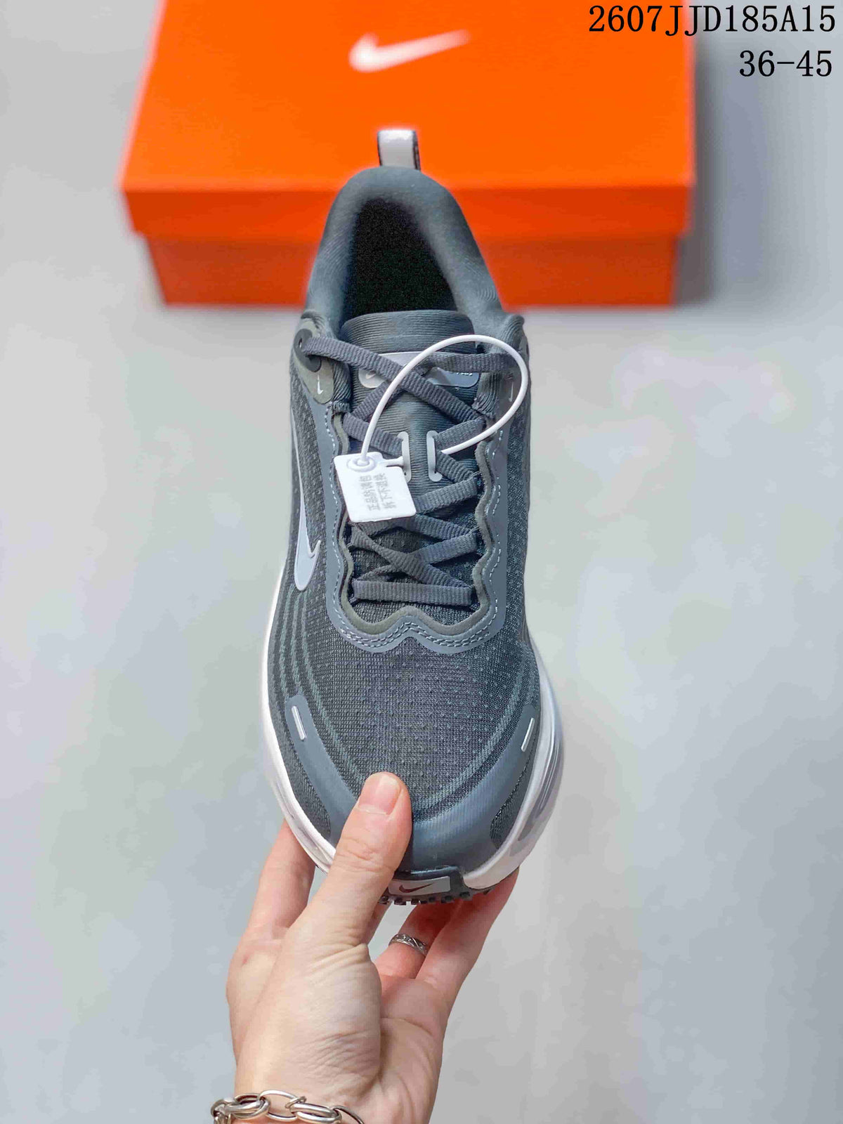 Front view showing the rounded toe, gray laces, padded collar, and layered upper design.