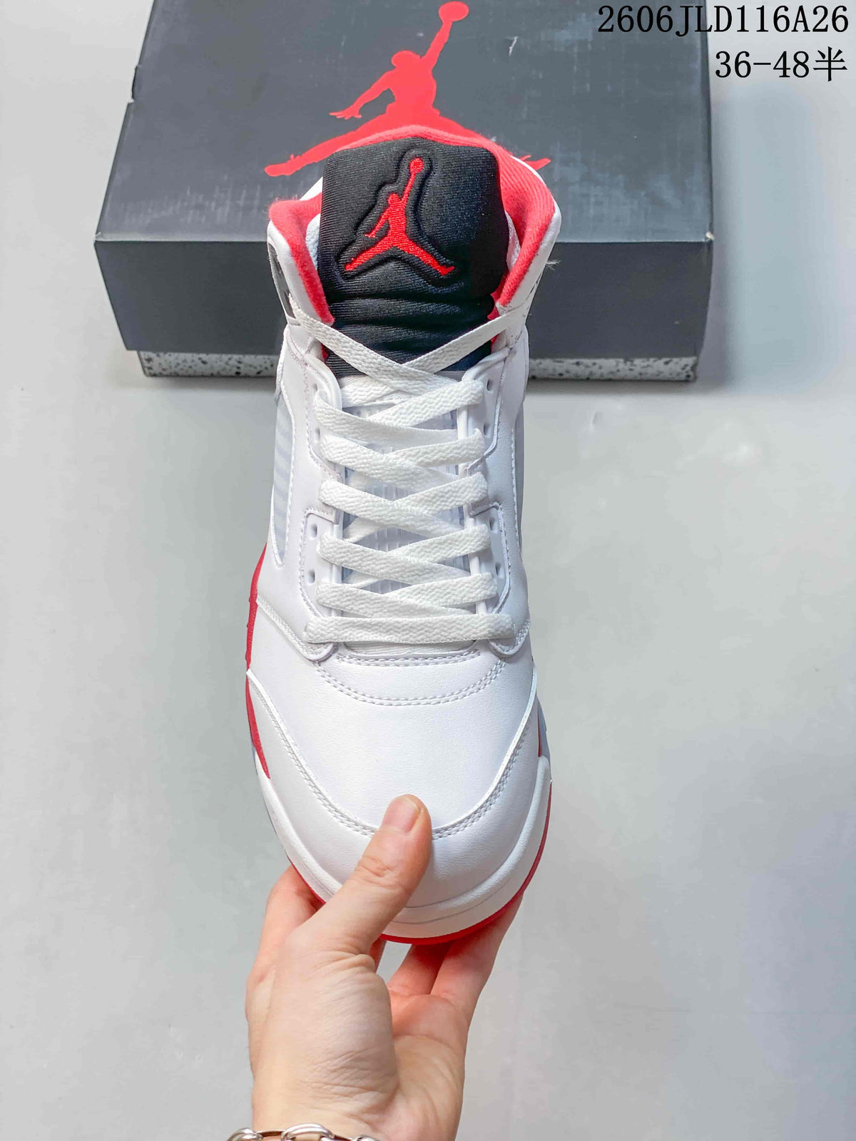 Front view of the white high-top sneaker with black and red tongue detailing