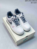 Pair of white and black Nike Air Force 1 low sneakers displayed on a branded shoe box; image text shows style code 2607JVD1199A19 and size range 36–45.