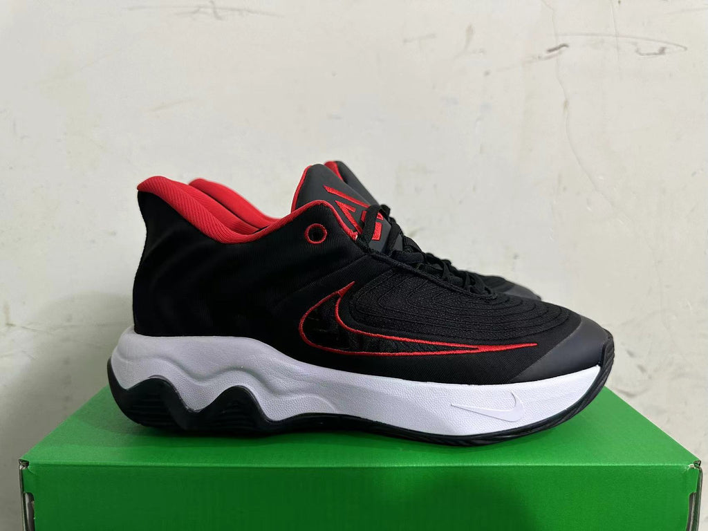 Side view of a black shoe with a red-outlined Swoosh and white midsole.