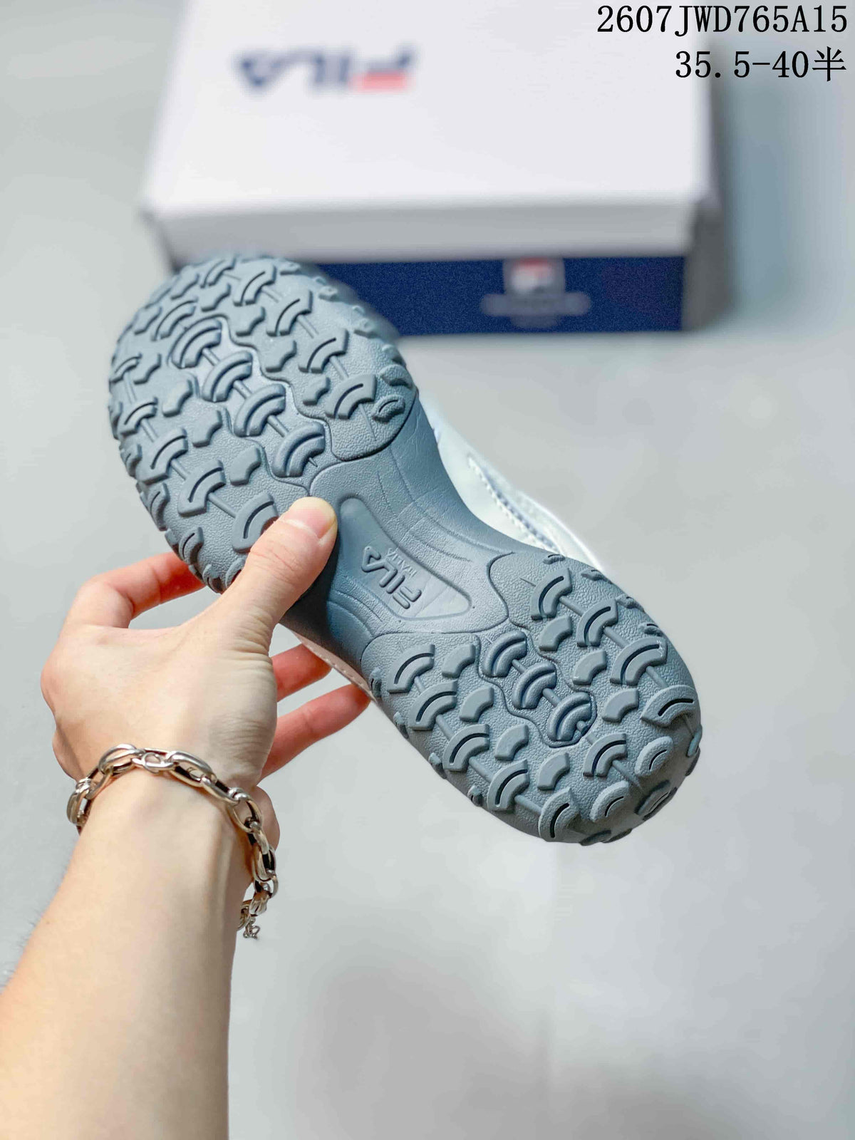 Close view of the gray molded outsole and tread pattern on a FILA sneaker