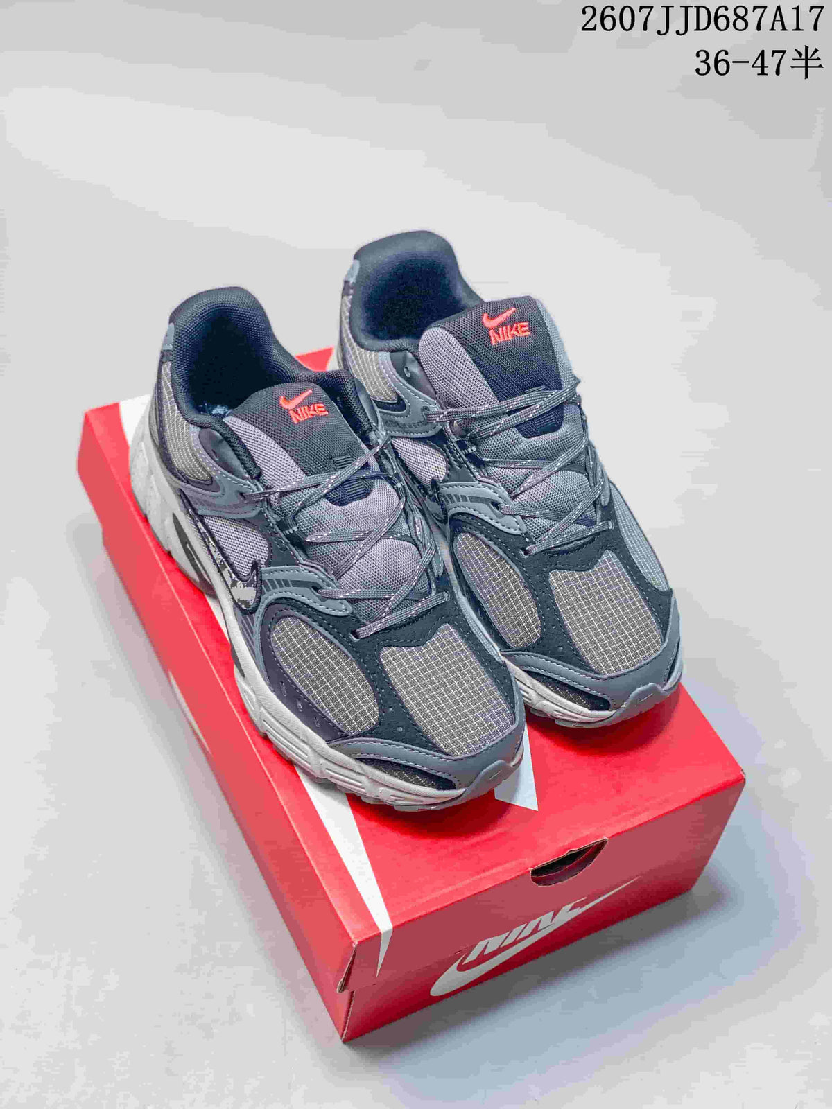 Pair of gray Nike V5 RNR sneakers displayed on a red shoebox, with the style code and size range visible at the top right.