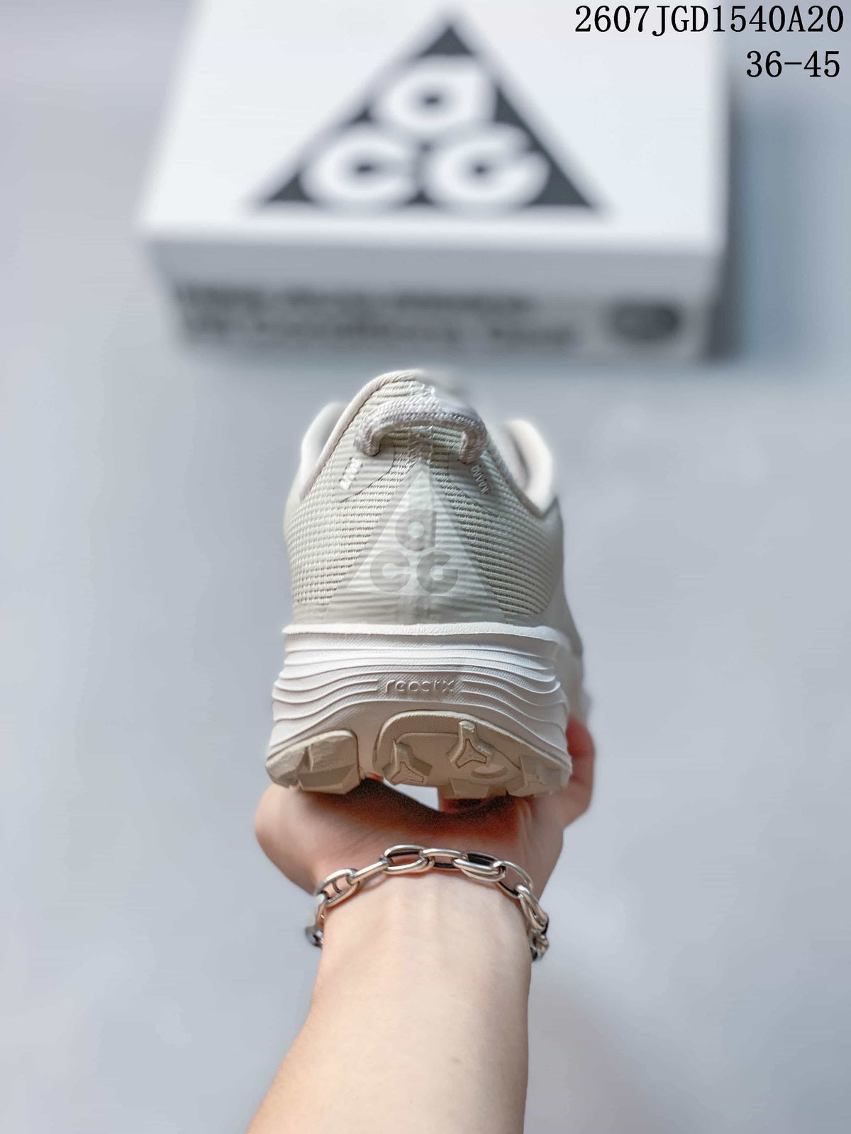 Rear view of the sneaker showing the padded collar, heel branding, and outsole shape.