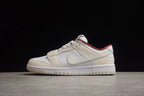 Side profile showing the off-white low-top design, white side branding, red collar accent, and rubber outsole.