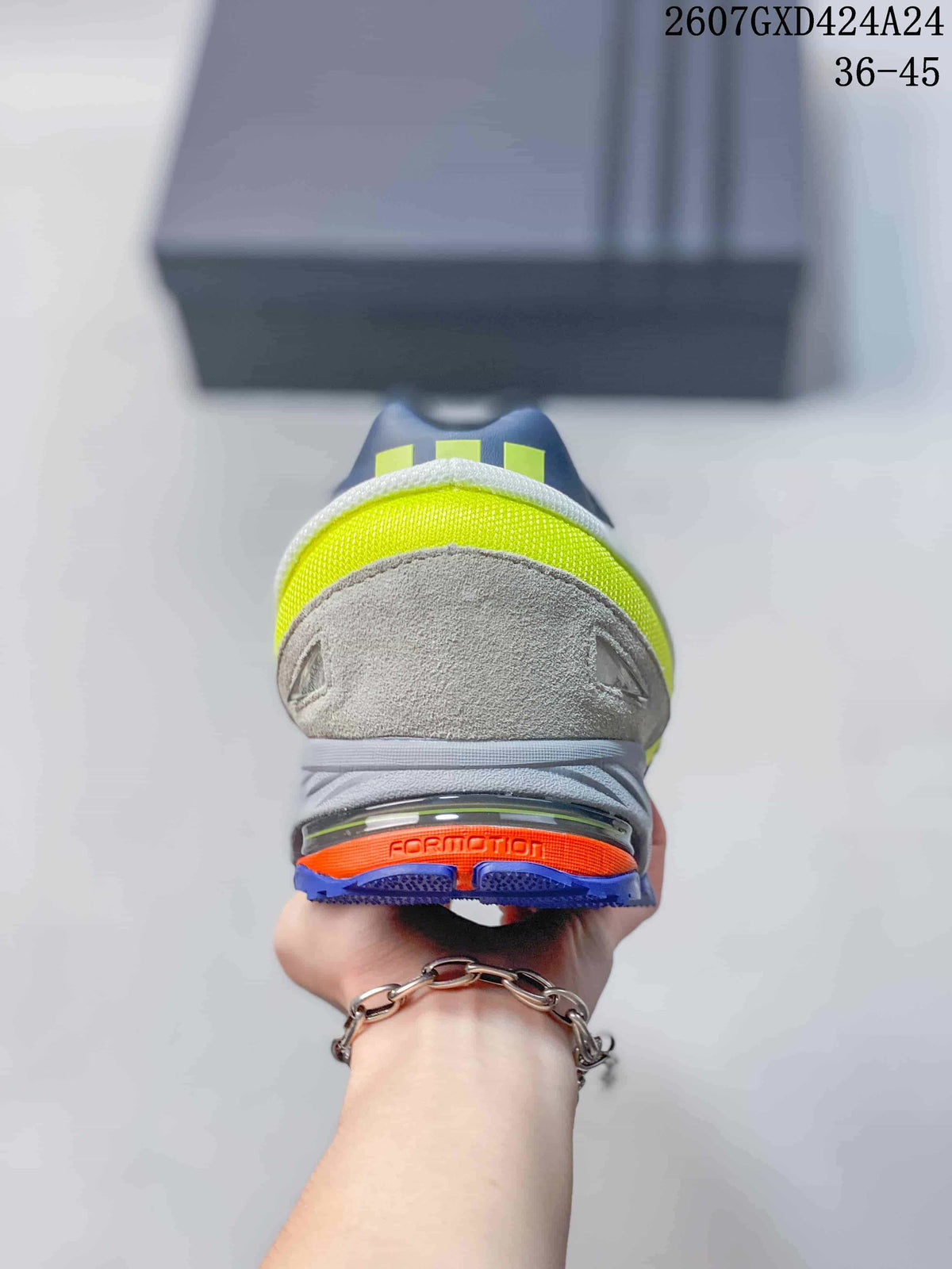 Rear view of the sneaker showing a neon yellow heel panel, gray upper and blue outsole with orange detailing.