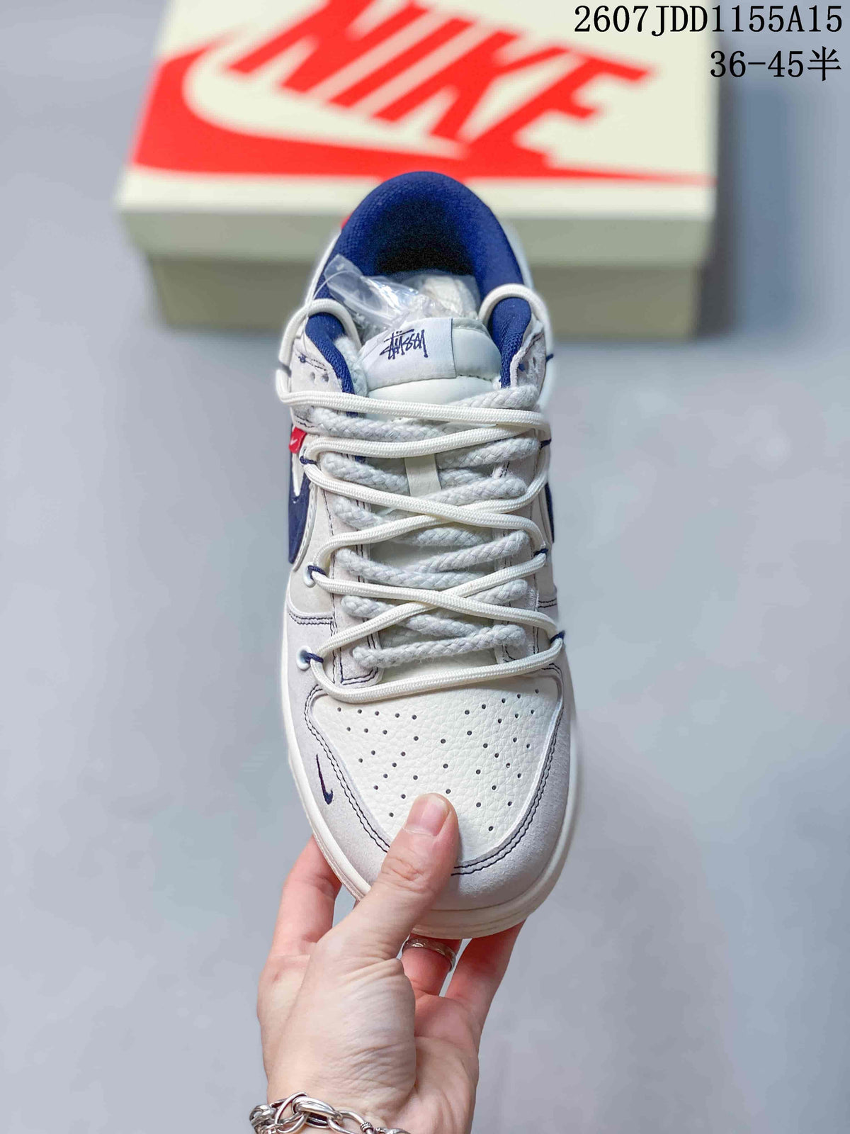Top view showing the perforated white toe box, layered laces and branded tongue.