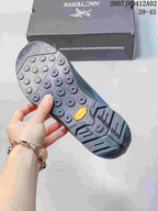 Close-up of the shoe outsole showing circular and angular tread details
