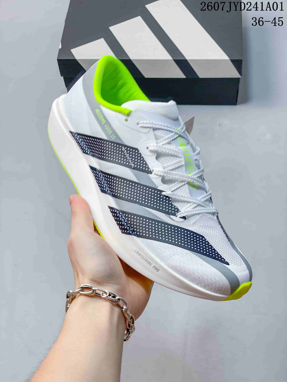 Side view of a white Adidas Adizero running shoe with dark stripes and neon yellow-green accents; image displays the size range 36–45.