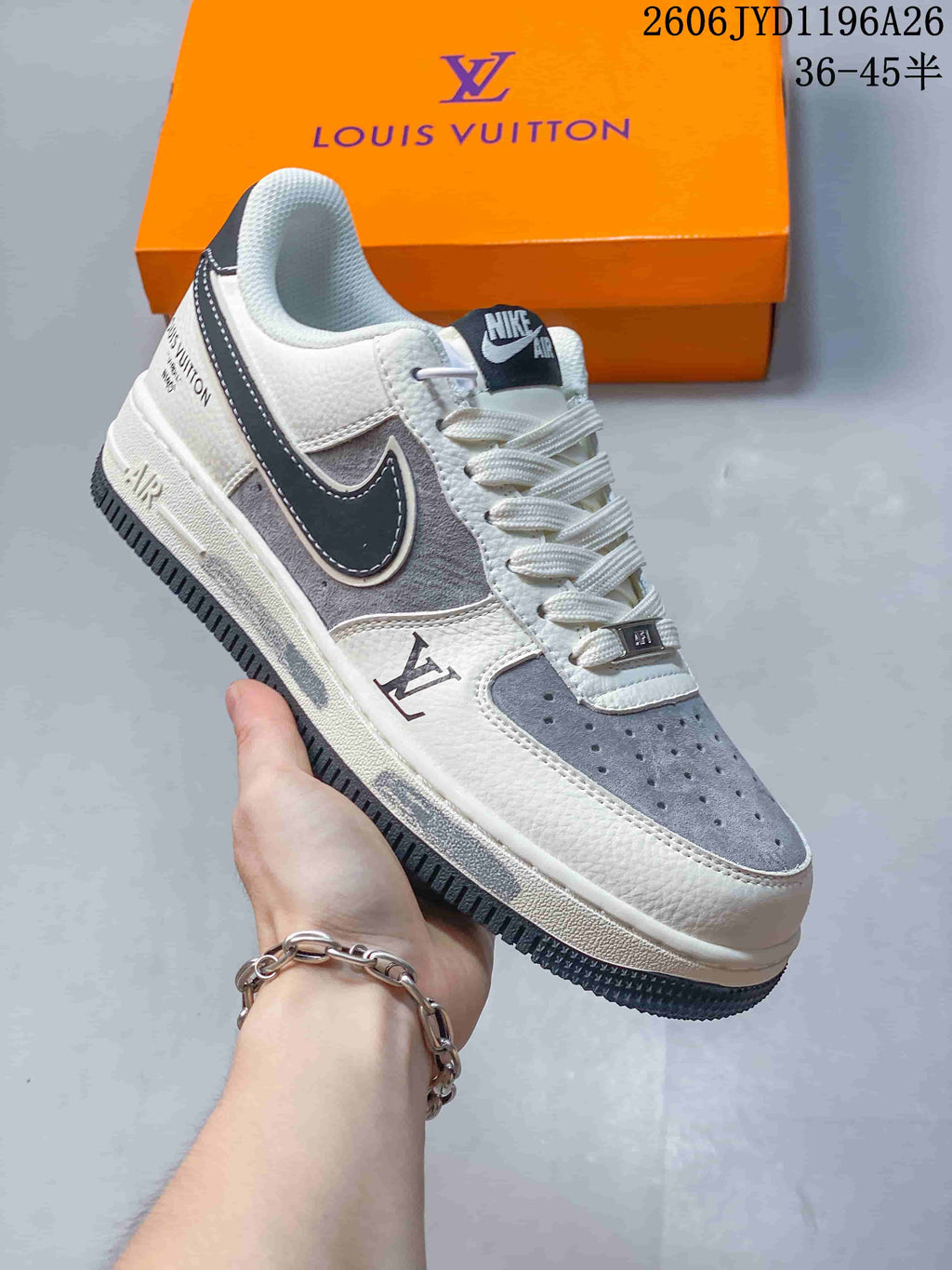 Close view of a white-and-gray sneaker with dark side detailing
