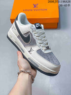 Close view of a white-and-gray sneaker with dark side detailing