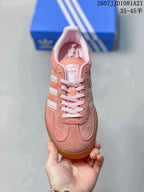 Top view showing the lace-up front, pink tongue and white stripe detailing.