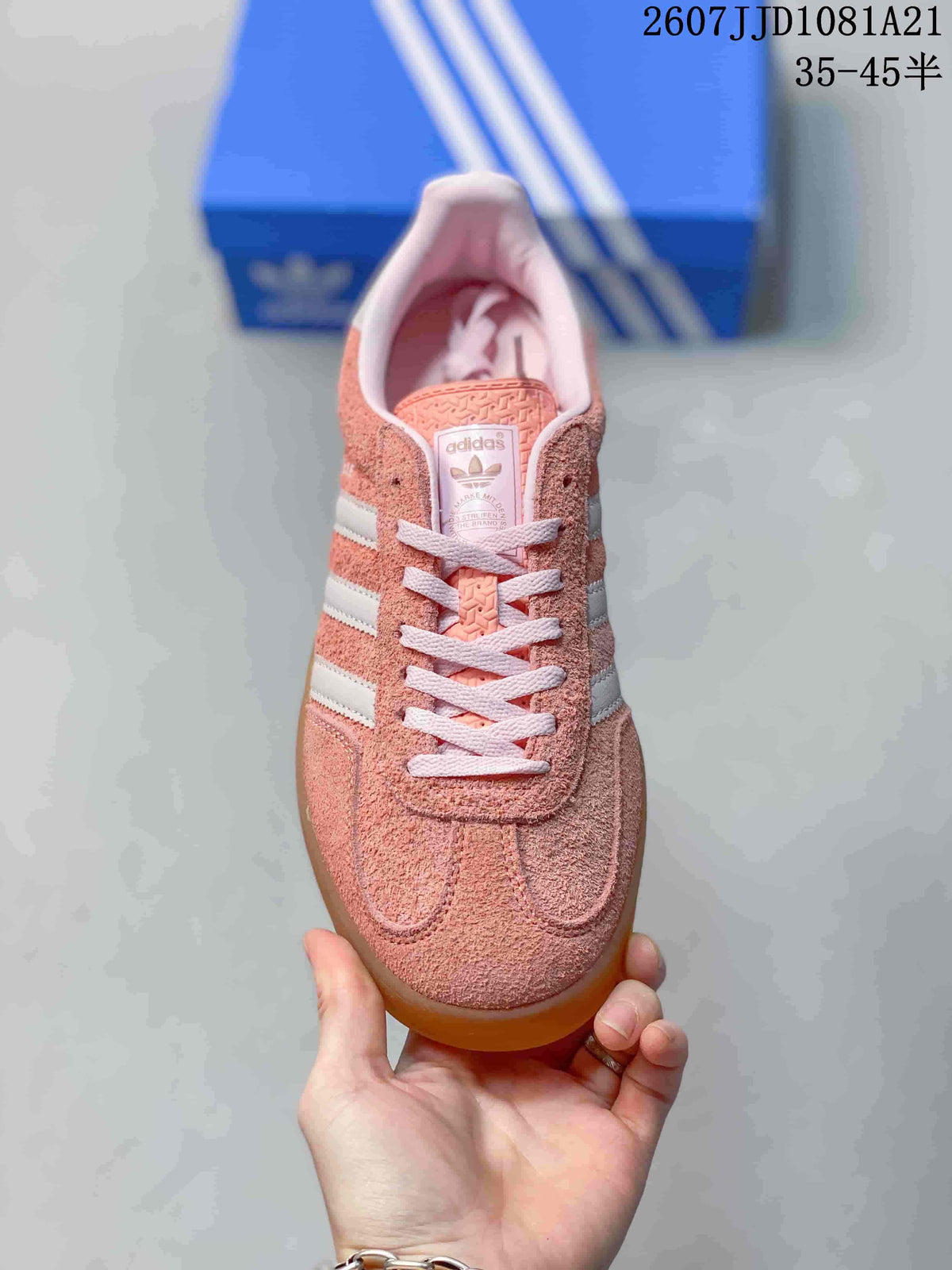 Top view showing the lace-up front, pink tongue and white stripe detailing.