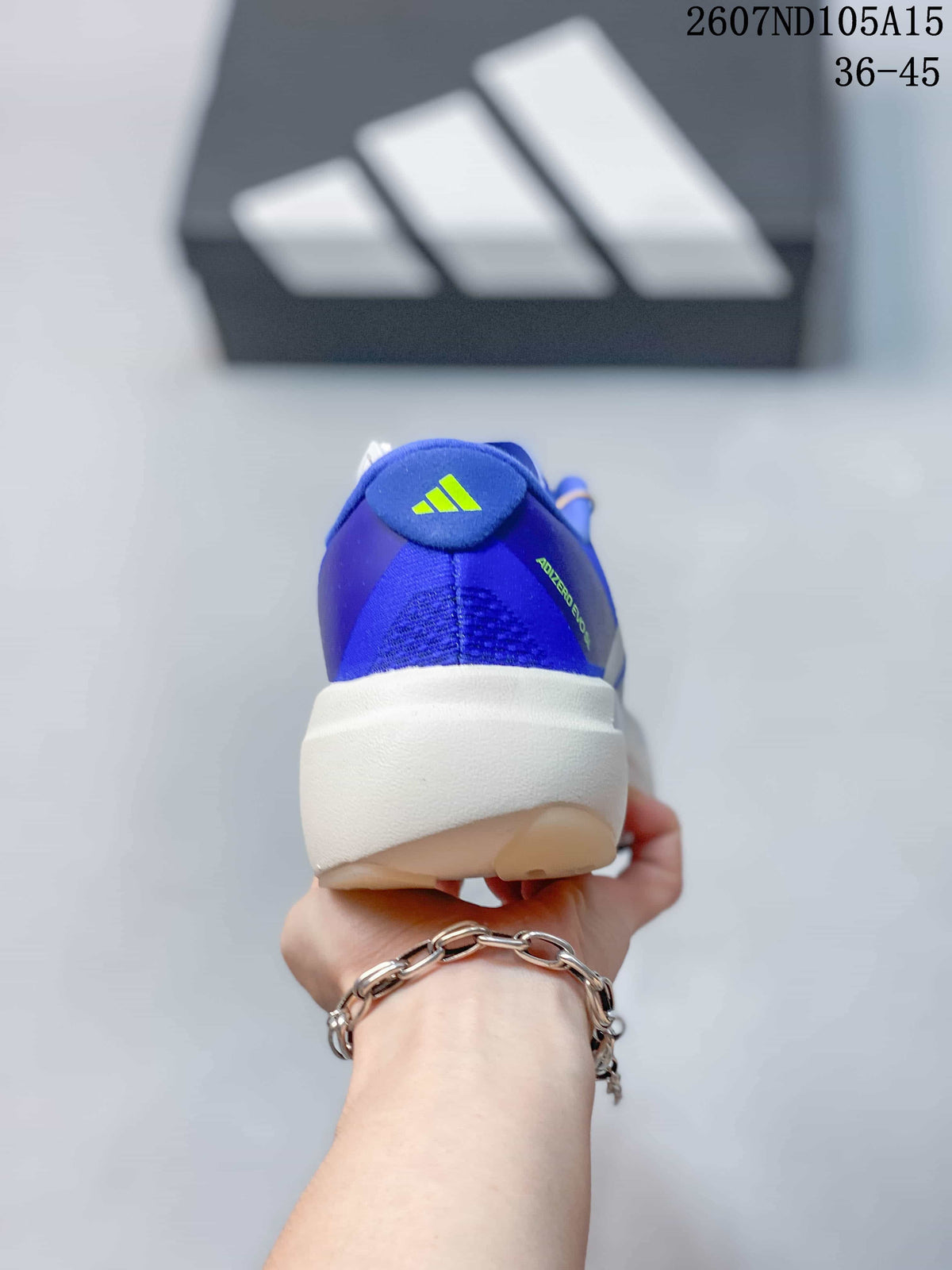 Rear view of the blue sneaker showing the Adidas logo, padded heel area, and light-colored midsole.