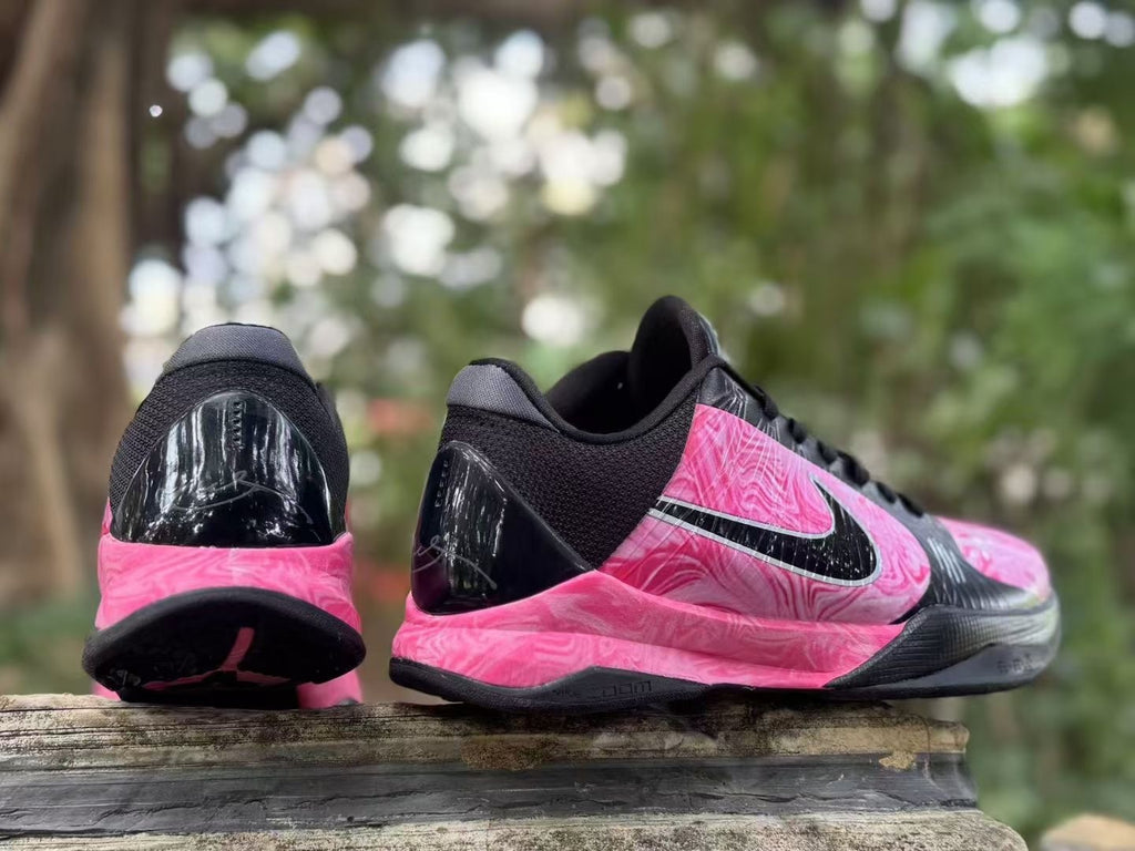 Rear and side views of the pink and black shoes