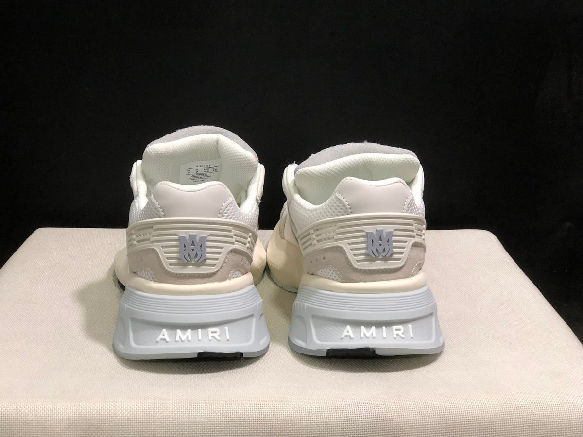 Rear view showing AMIRI branding on the heels and the padded heel structure.