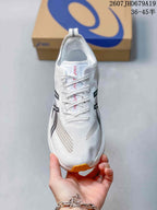 Top view of the white running shoe showing the lace system, textile-style upper, and black side branding.