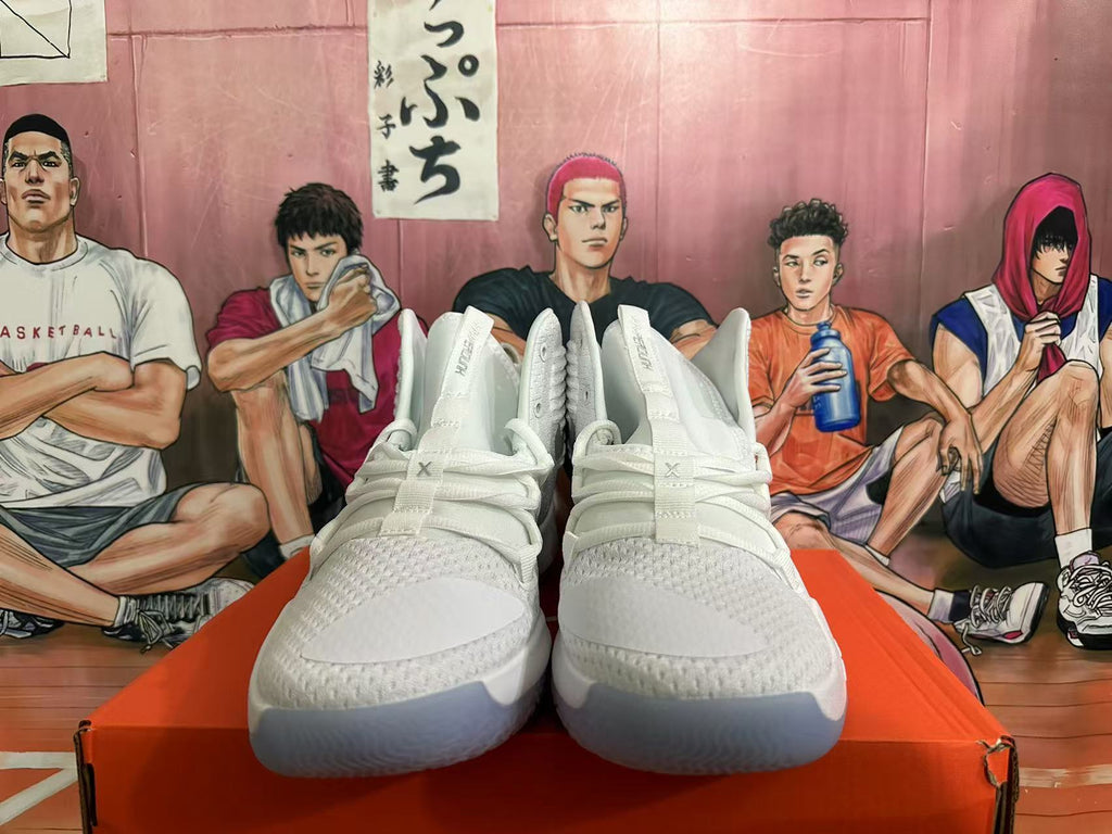 Front view showing the white uppers, textured panels, and lace-up closure