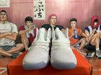 Front view showing the white uppers, textured panels, and lace-up closure