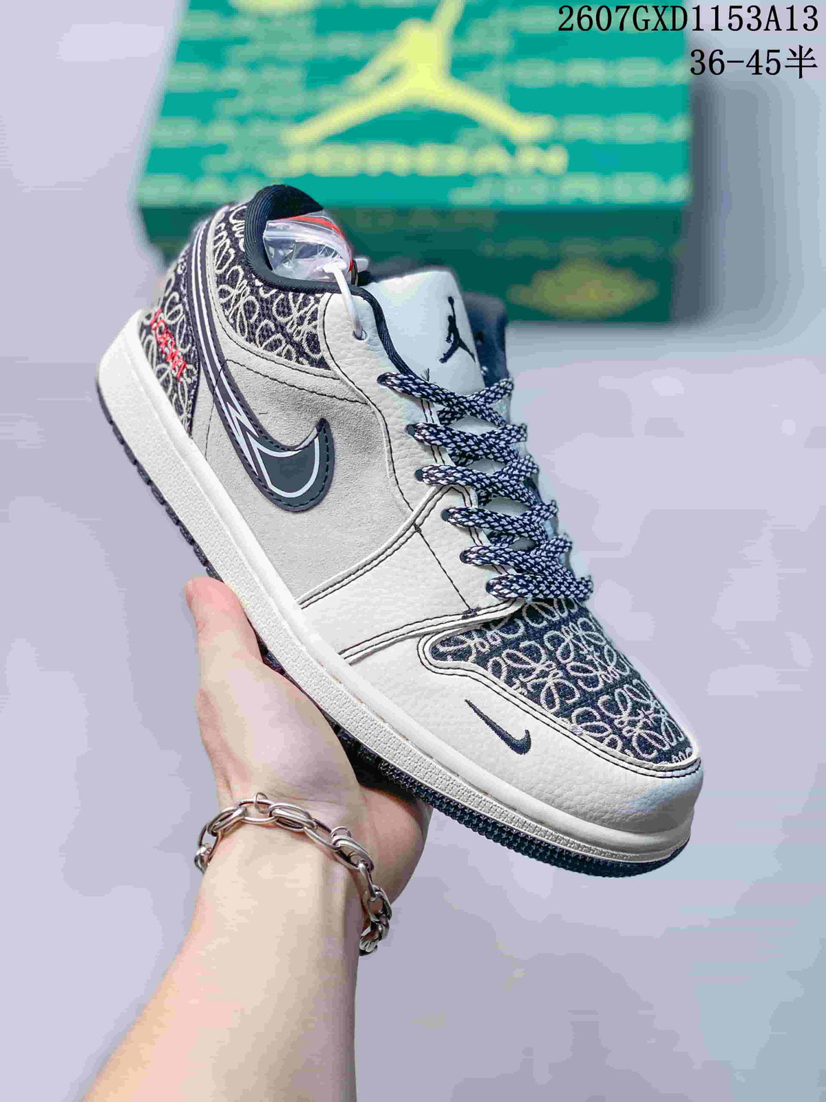 Angled side view showing the low-top silhouette, patterned toe and heel panels, navy Swoosh, and white midsole.