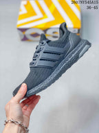 Side profile of the dark gray sneaker showing the knitted upper, molded side cage, lace area, and textured midsole.