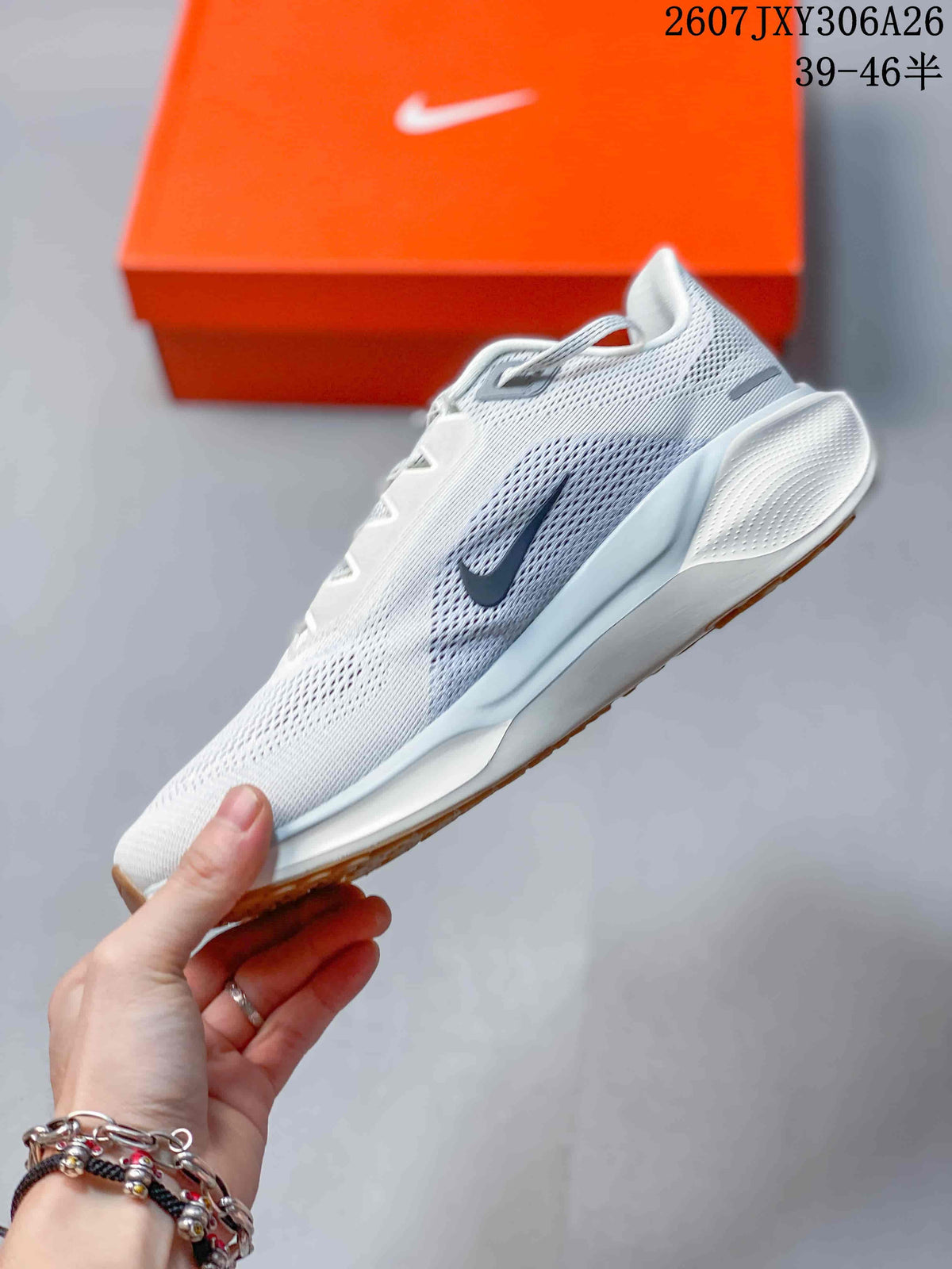 Side profile of the white and light grey sneaker with dark swoosh accent.