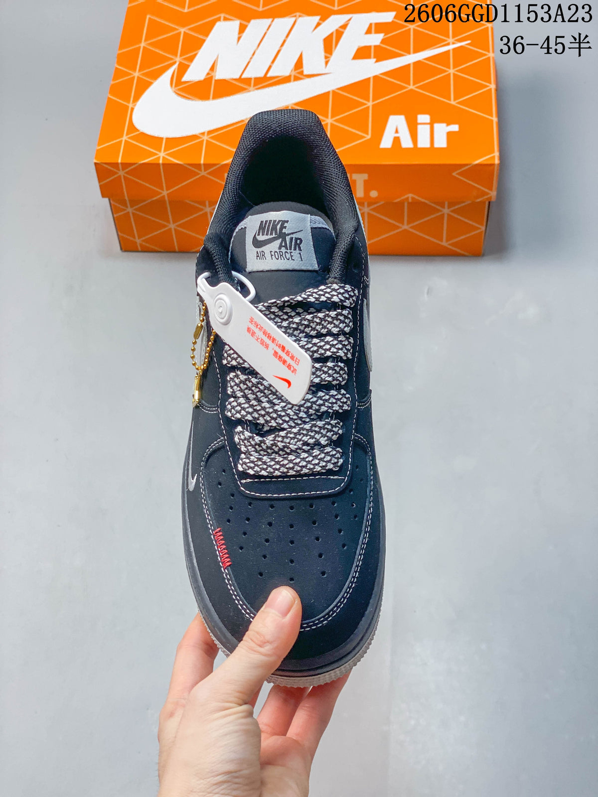 Top view of the sneaker showing perforated toe, patterned laces, and tongue label