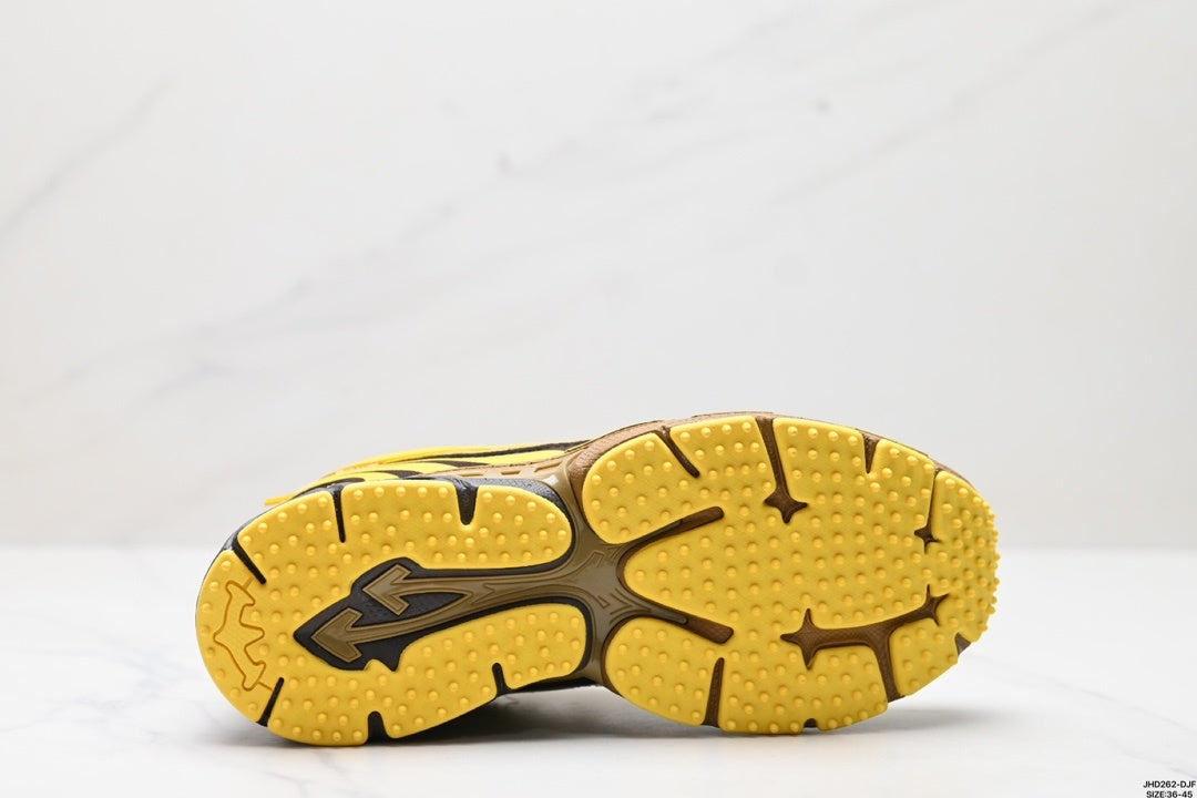 Outsole view showing the segmented yellow tread pattern with raised textured sections and dark traction lines.