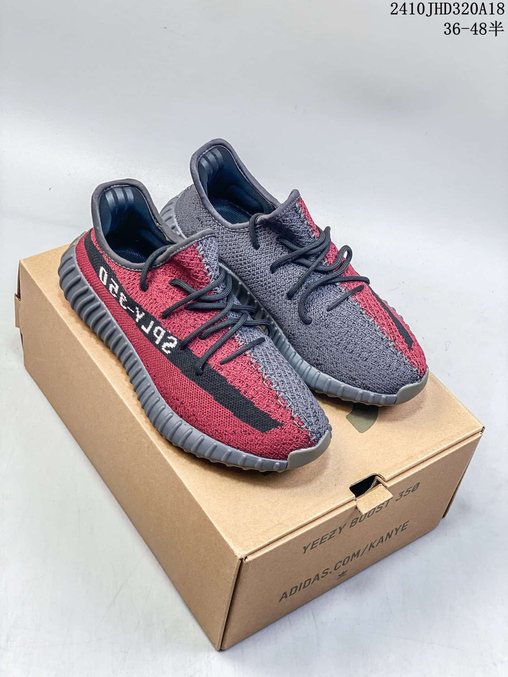 Pair of red and gray Adidas Yeezy Boost 350 V2 sneakers displayed on a shoe box; style code 2410JHD320A18 and size range 36–48.5 are visible.