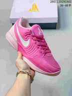 Bright pink Nike JA 2 basketball shoe with a white Swoosh and matching laces.