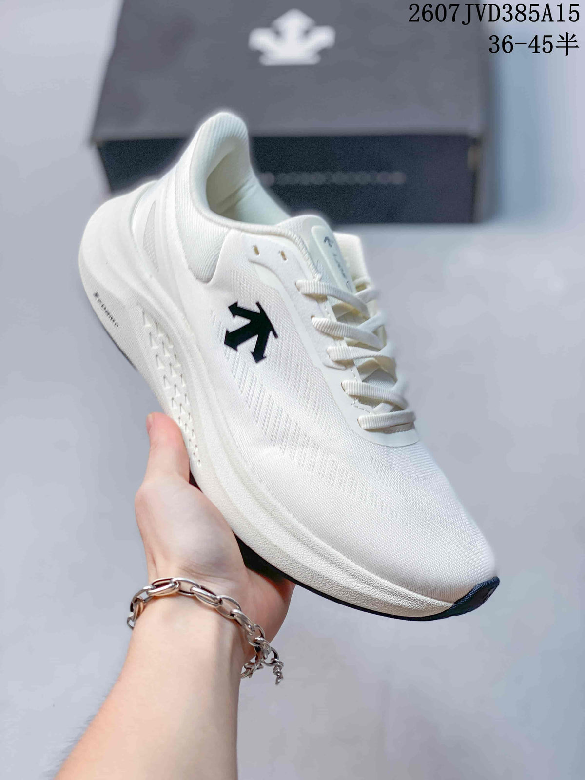 Side view of a white Descente EASE WIRE sneaker showing the logo, lace system and layered sole.