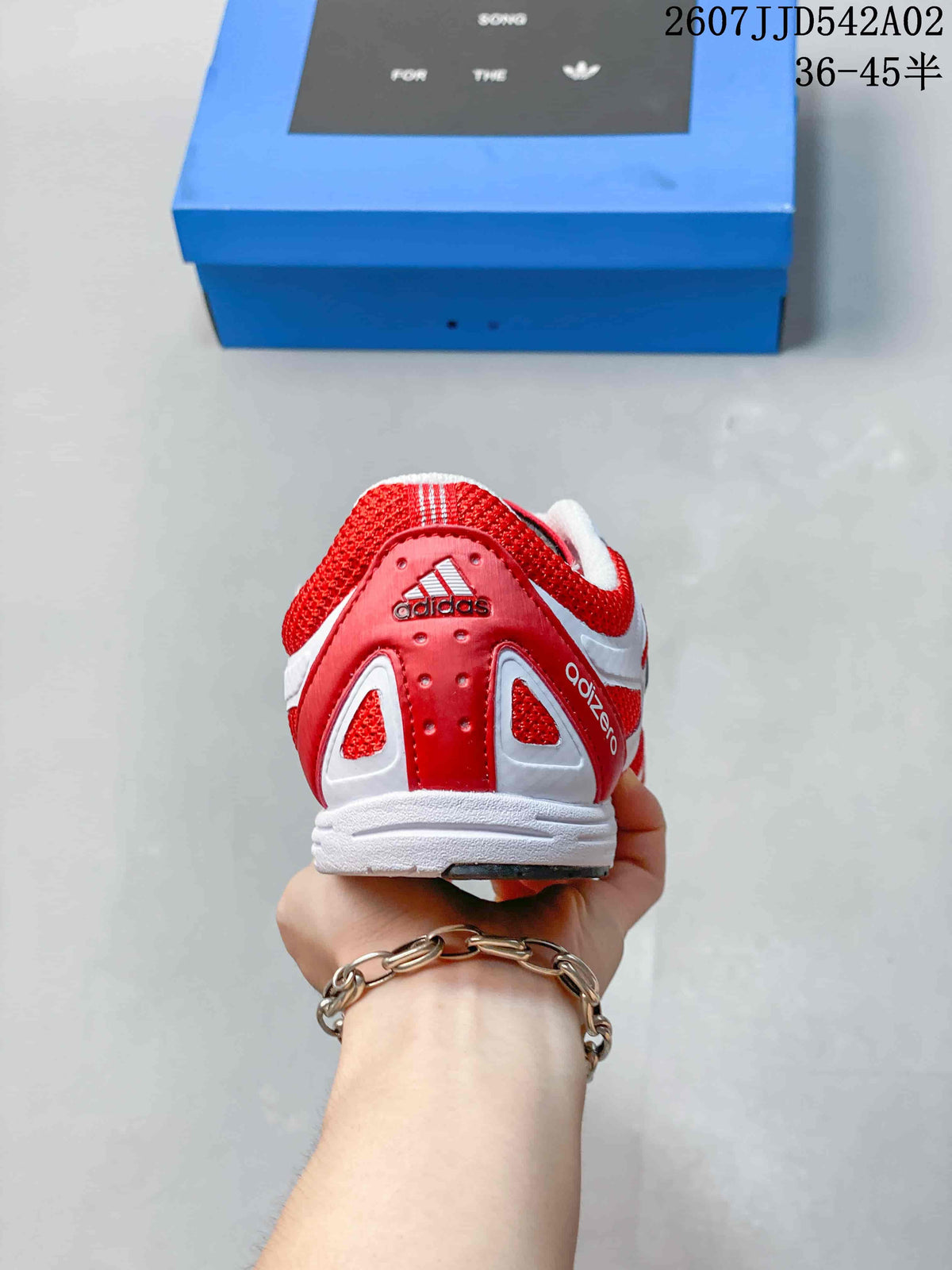 Rear view of the red and white adidas Adizero sneaker