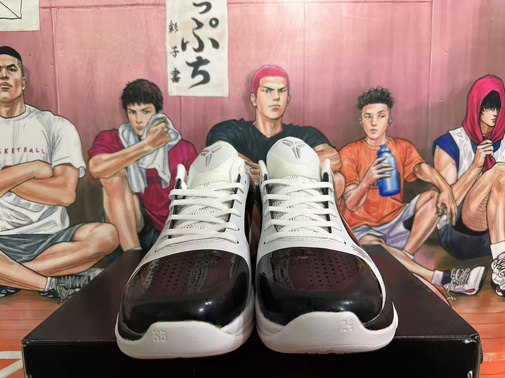 Front view of black and white Nike basketball shoes with white laces.